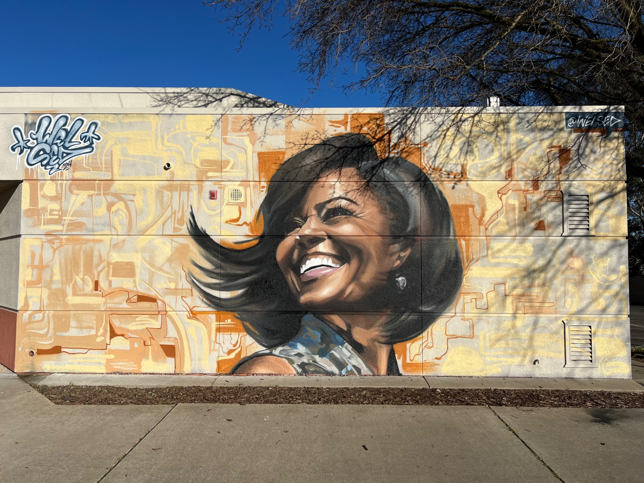 Father Keith B Kenny Elem. mural by Sacramento artist Wel Sed celebrating female empowerment